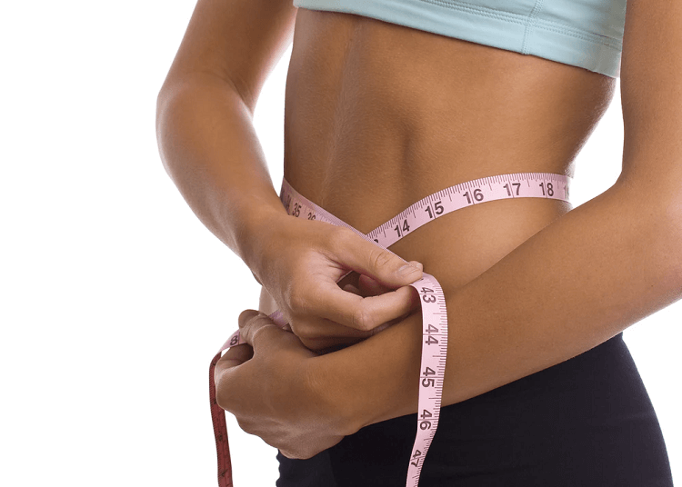 woman measuring waist